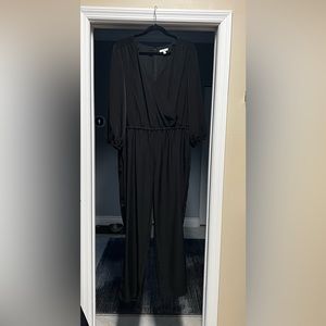 Halston, long sleeve, black Jumper with plunging neck line. Size XL